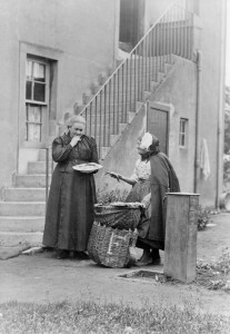 Phemie, an east coast fishwife, selling fish in Corstophine, early 1900s. Scottish Life Archive