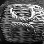 curling basket with handles on side